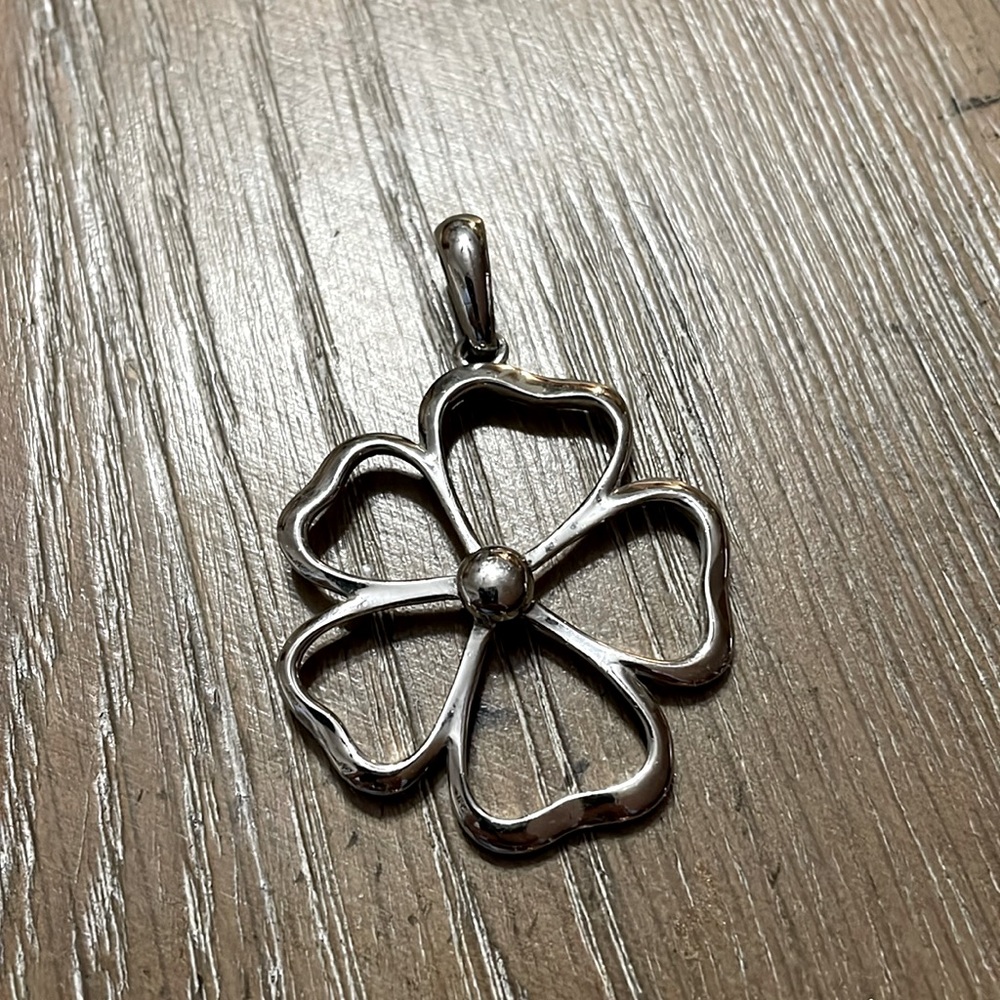 Silver flowered slide, made by Lia Sophia